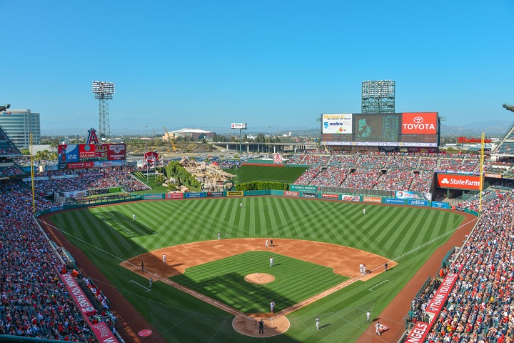 Shadows fall across the third-base line and left field at Angel Stadium as the sun moves into the southwest during an afternoon game in Anaheim, Calif.